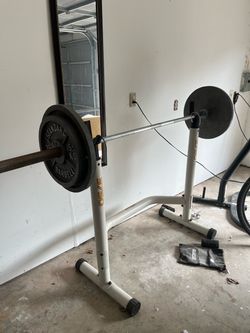 Squat Rack with Barbell and Weight Plates