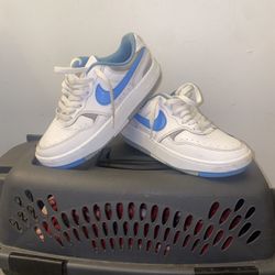 white and blue nikes
