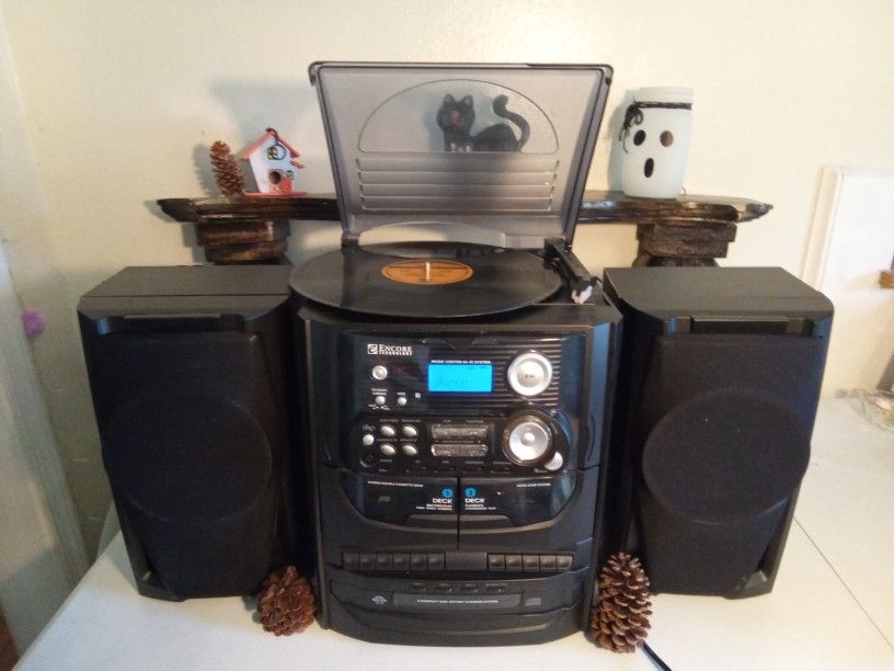 Audio System..Album Turntable, 3 CD, 2 Cassette, AM/FM Radio, Speakers...Music Center Hi- Fi