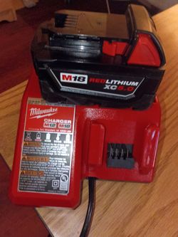 Milwaukee 12 v and 18 v charger w. Battery