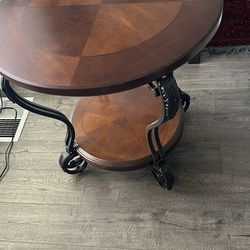 Solid dark oak end table.  28” diameter