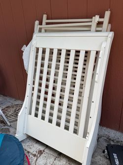 White Wood Baby Crib Frame Disassembled