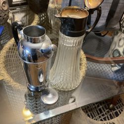 Two Old , Vintage. Carafes (NO SHIPPING) One Is In Glass, The Other One Is Silver 