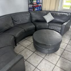 Living room set: high-quality, all-leather sofa and solid wood construction.