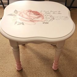$85 Blush pink and white table with French design. 
21 inches high 24 in wide 24 in front to back