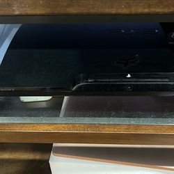 PlayStation 3 With 2 Remotes And Games