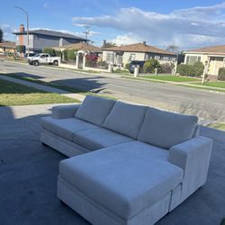 Beige Living Spaces Couch Reversible Sectional 