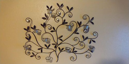 Stained metal frame with candle holders