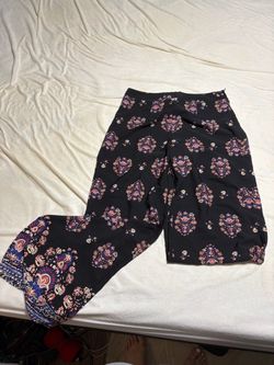 High-rise wide-leg pants with an all-over floral medallion pattern.