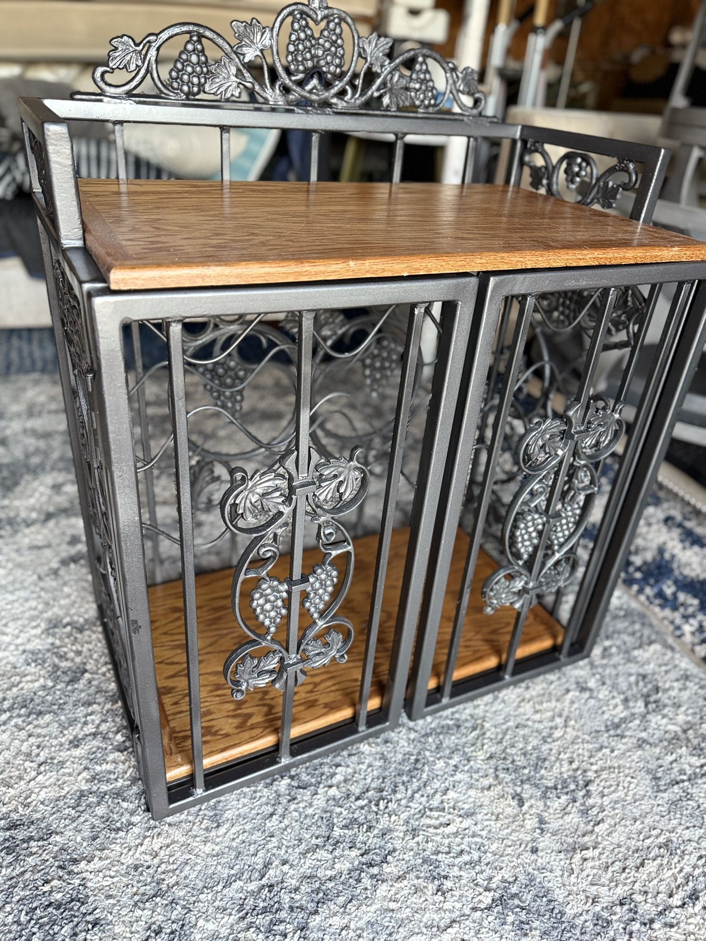 decorative wine rack or wine cabinet with a grape and vine motif.