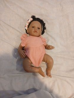 Lifelike Reborn Baby doll with pink outfit