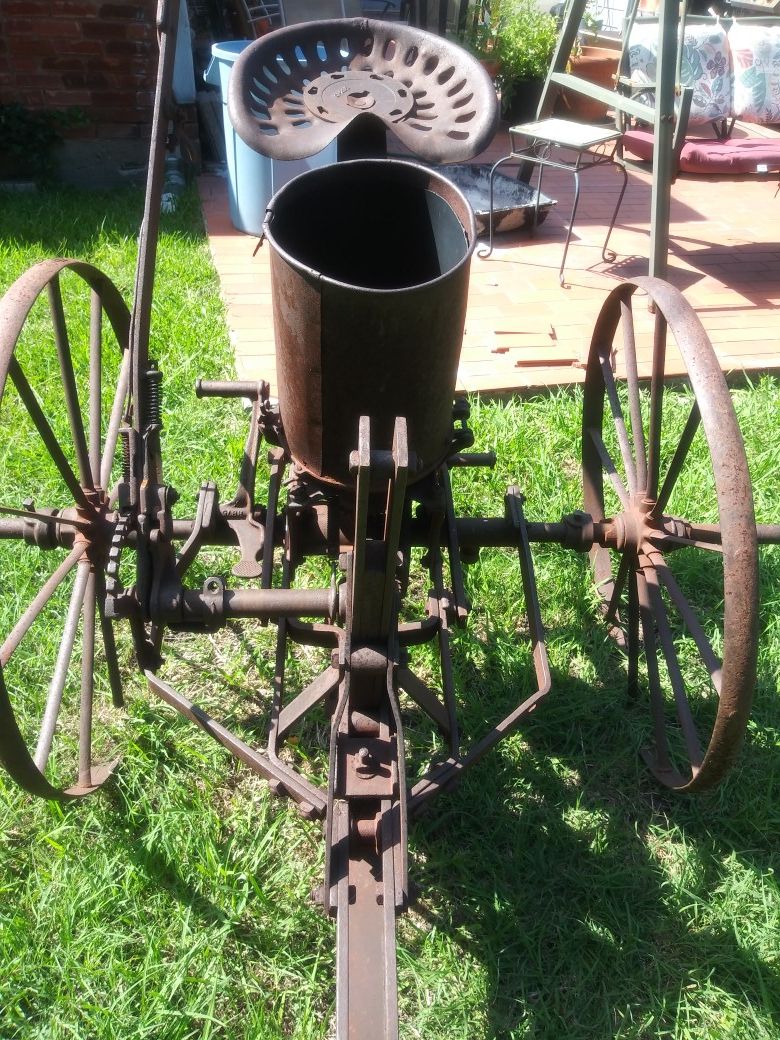 Antique seeder planter and plow