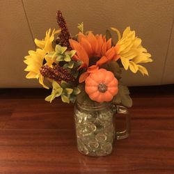 Mason jar with pumpkins and sunflowers fall flower arrangement