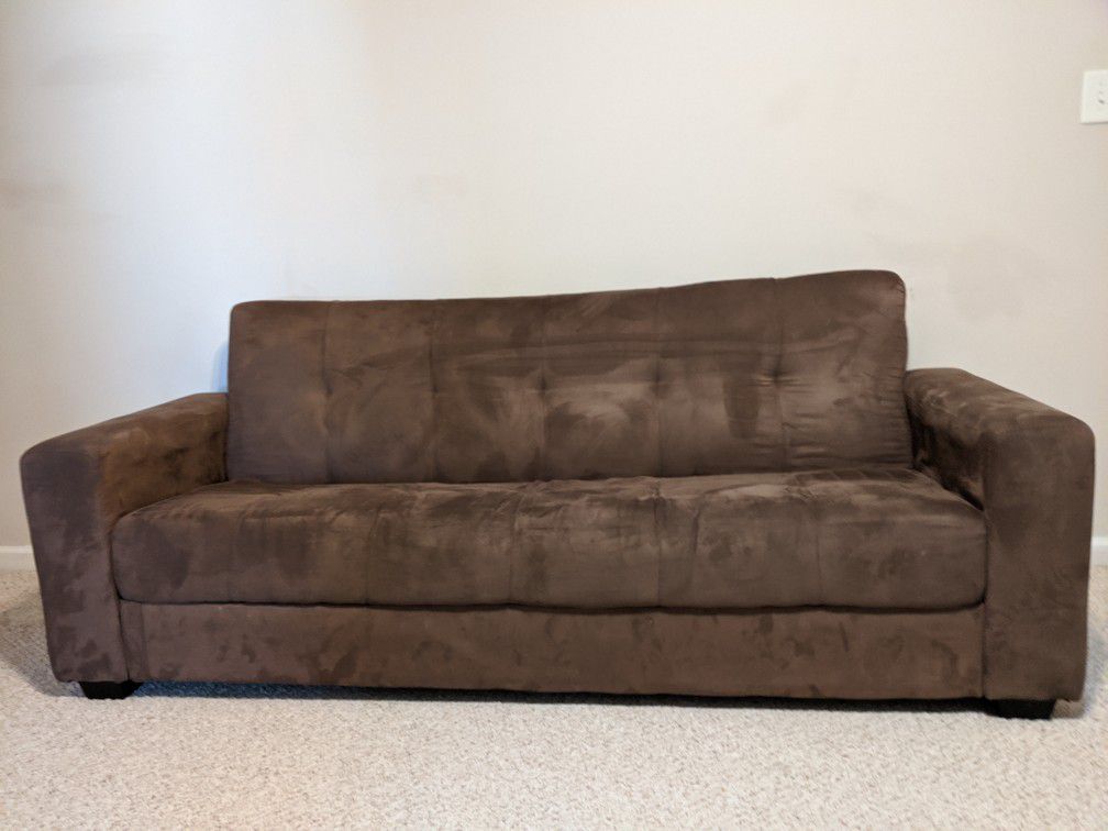 Brown couch fold out to a full bed