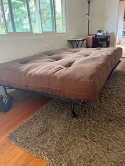 Brown Futon excellent condition. Full size.