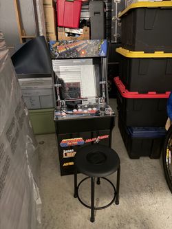 Asteroids Deluxe Arcade Game with chair
