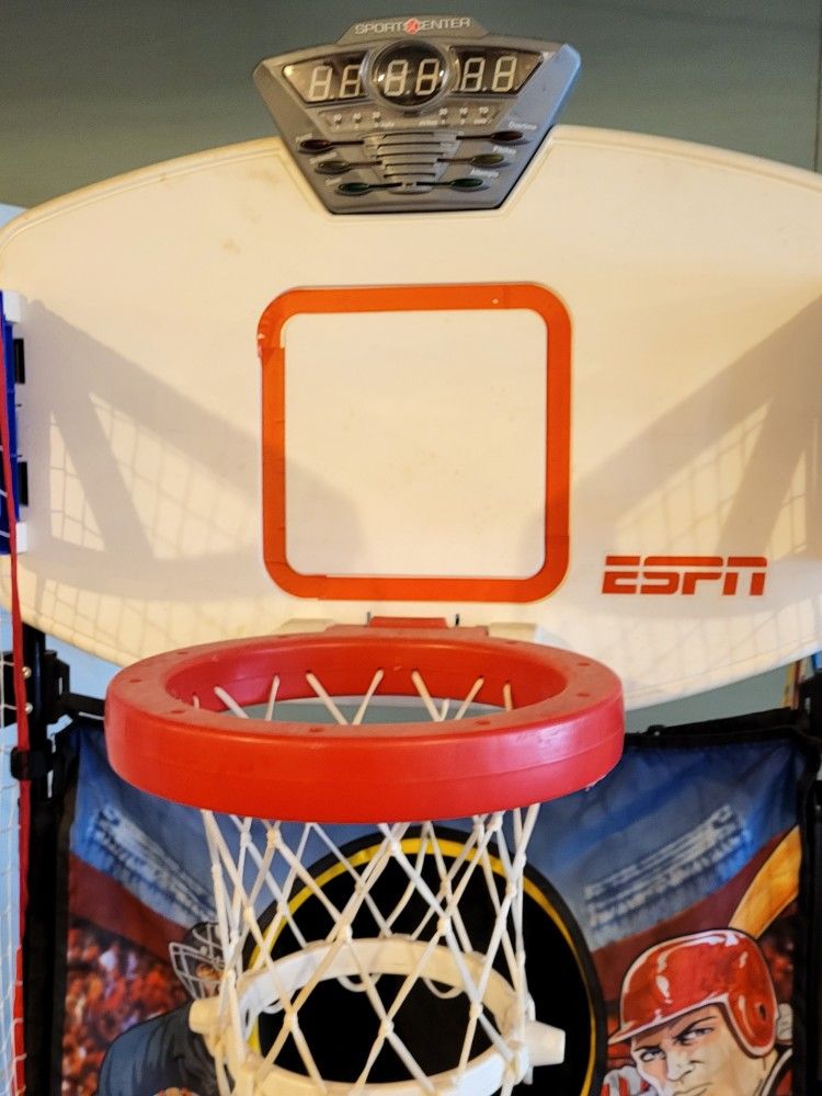 ESPN pop a shot type game. Has games for basketball, football, baseball, golf, and hockey. Electronically keeps score. Great shape and folds up