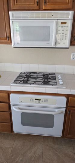 GE  White in wall oven, cooktop, dishwasher and microwave