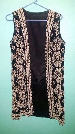Vintage long vest...size small. ..Black with white raised beads...great condition!