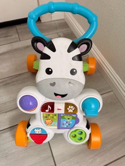 Fisher Price Walker, Ride On, and table