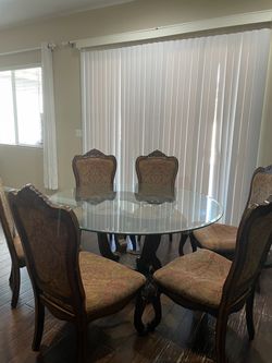 Elegant Glass Dining Table & 6 Ornate Upholstered Chairs – Sold Separately