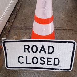 Road Closed Sign And Orange Cone