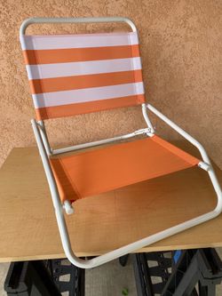 Beach chairs sun and sky orange