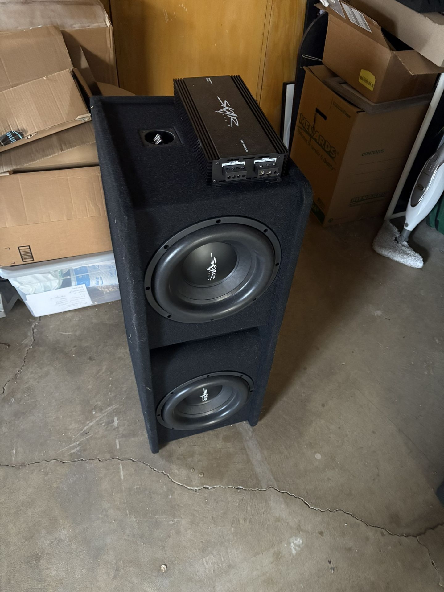 2 12 Inch Skar Subs With Box. And Also 1500 W Skar Amp