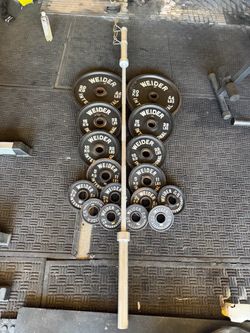 Olympic weights 253lbs total plus 7ft bar