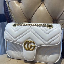 White Purse With C and G on It. 