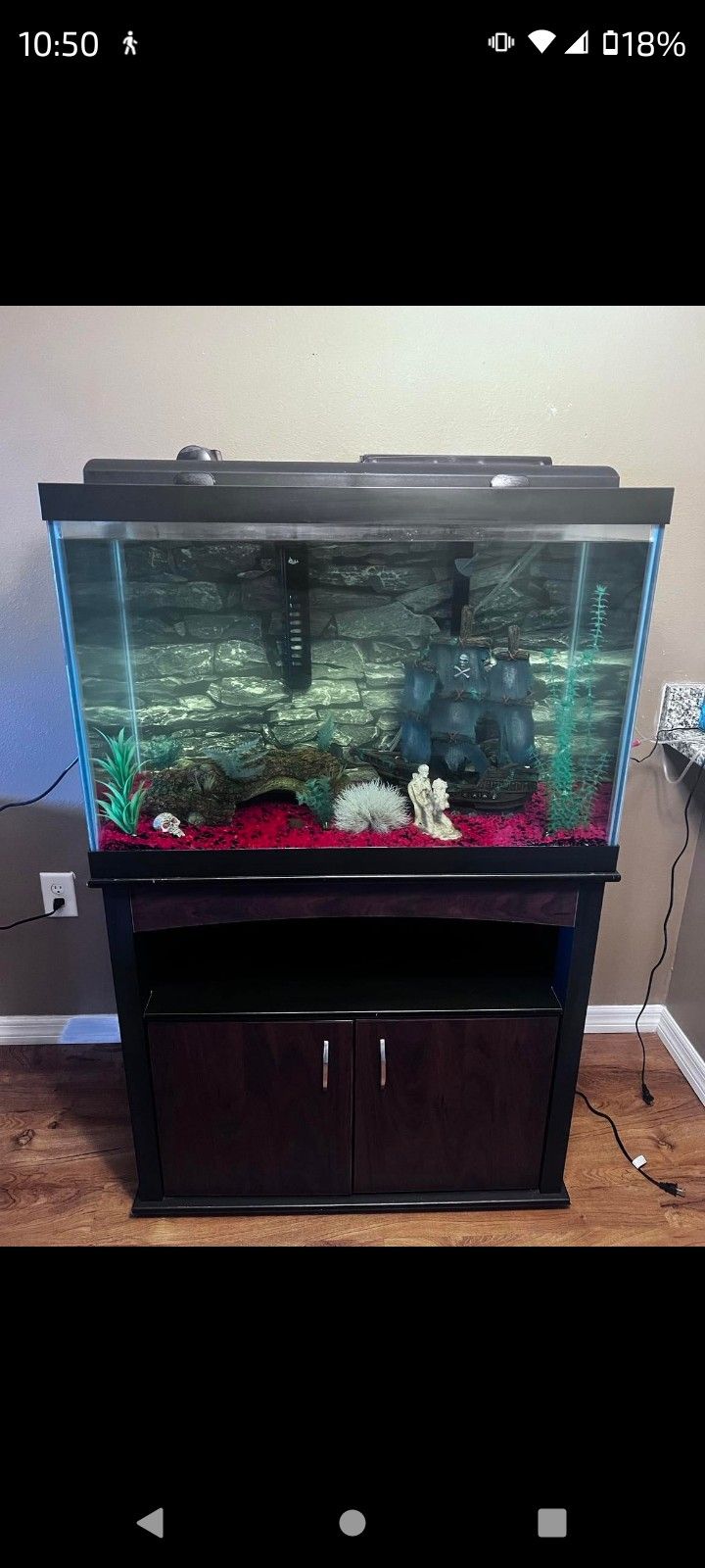 65 Gallon Fish Tank . Accessories Included . Filter System Included As Well As Tank Decor. Stand Is Included.
