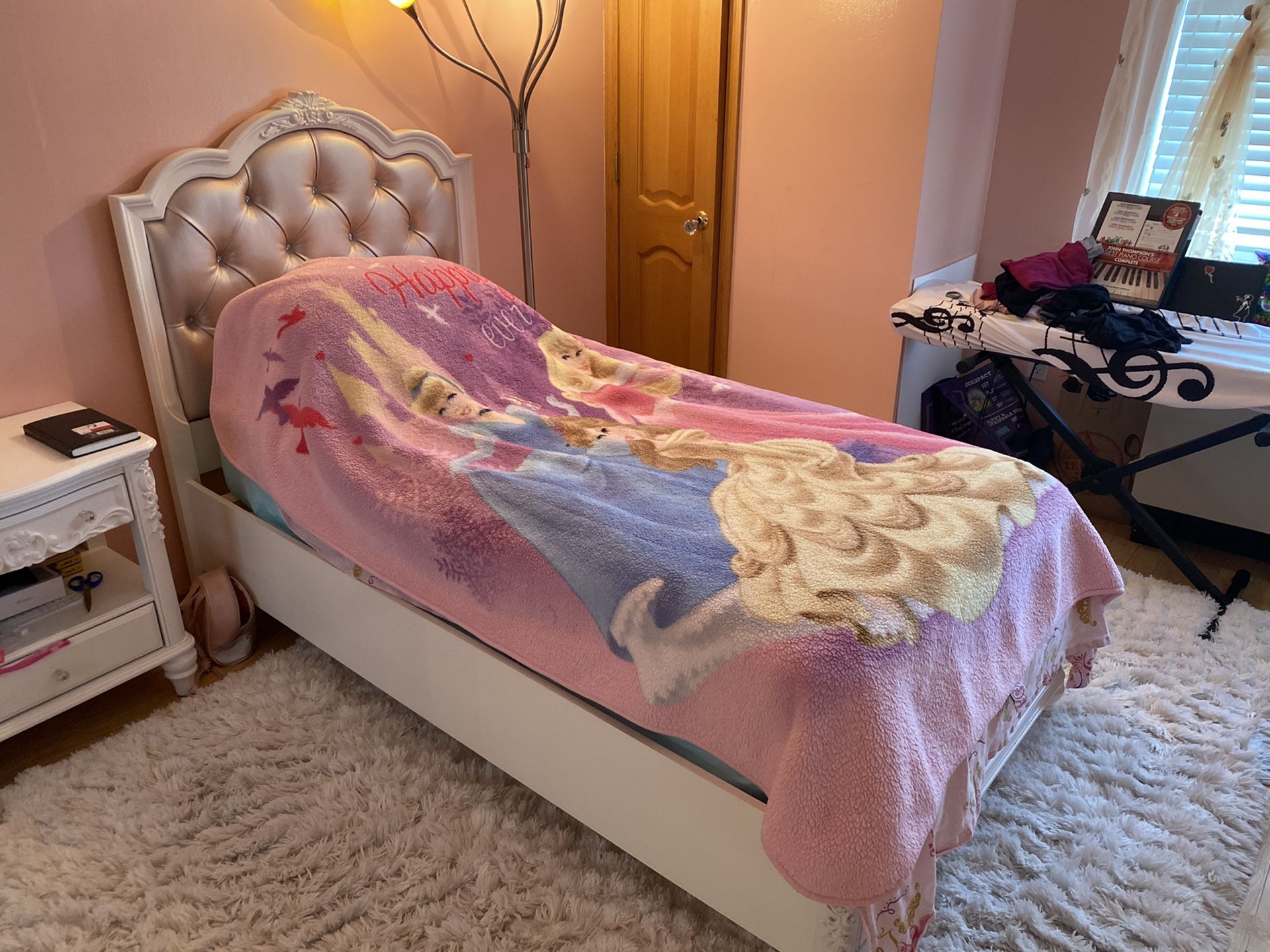 Twin size princess Caroline bed with a nightstand