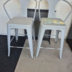 Tall metal bar stools.