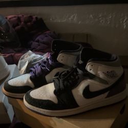 Air Jordan 1 Mid SE in a white, black, and varsity purple colorway