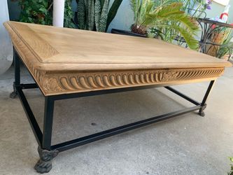 a Restoration Hardware French oak and metal coffee table.