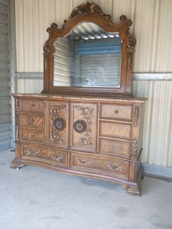 Dresser with beveled edge mirror