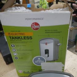 Rheem RETEX-13 Tankless Water Heater/Boiler - Gray. new. damage box. item are still new with all the parts. 