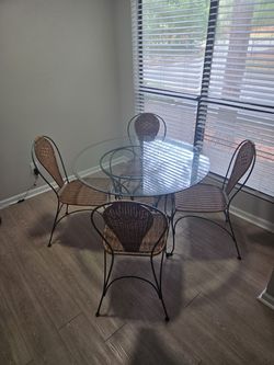5-Piece Round Glass Dining Set – Green Metal & Woven Chairs