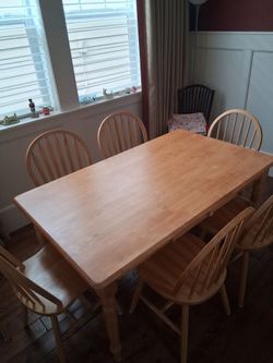 Kitchen table with 6 matching chairs.