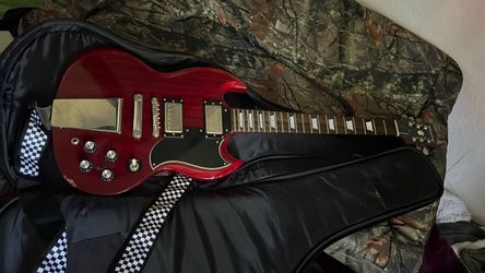 red Epiphone SG solid-body electric guitar without strings