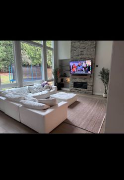 Urban Interiors White L-Shaped Sofa. Original Price is $10,000