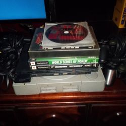 Sony PlayStation PS1  And PS2 Slim With Games Like GTA2, WWF Smackdown, HBO  Boxing, 3 Controllers,  PS2 Memory Card And Connection Wires.