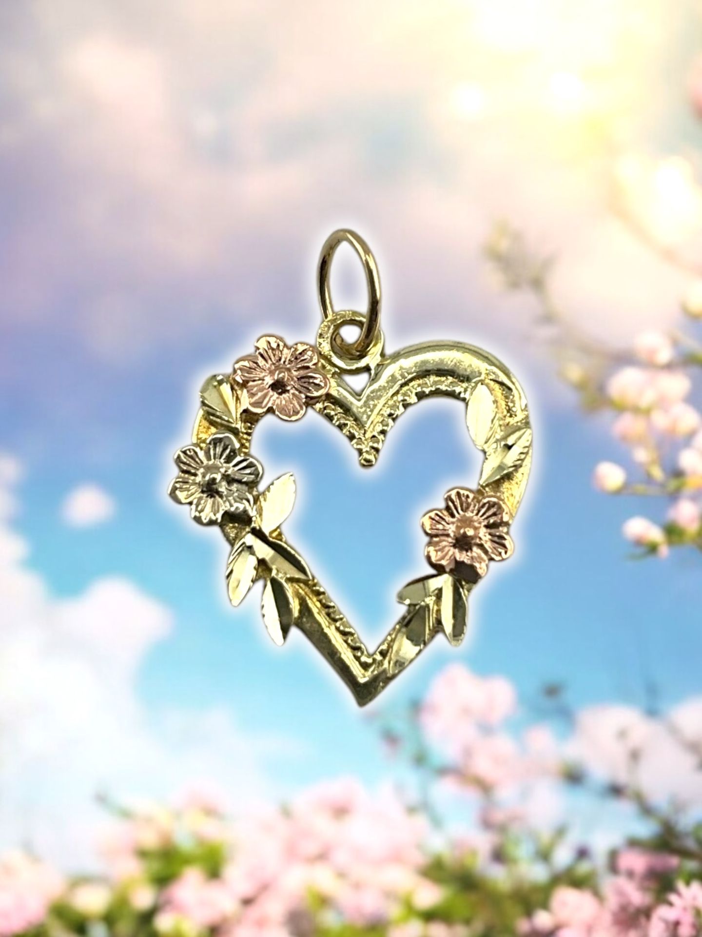 14kt 1.10g Tri Color Gold Floral Heart Pendant.