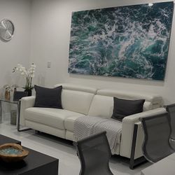 White Real Leather/Vinyl Power Reclining Sofa Loveseat Excellent Condition. Adjustable Headrest / Footrest. Dimensions: 83W x 33H x 43.5L. Was $2,400