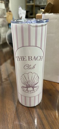 tumbler featuring a coastal "The Bach Club" seashell design. These insulated stainless steel travel mugs are heavily