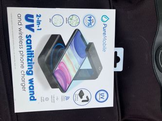 Wireless phone charger and sanitizer