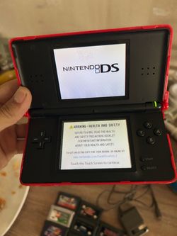 Nintendo DS with games and charger