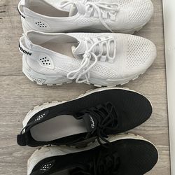 Two pair of tennis shoes, one white one pair of black