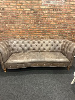 Tufted leather sofa