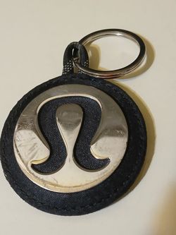 Lululemon logo key chain. Minor scratches as noted in photo.